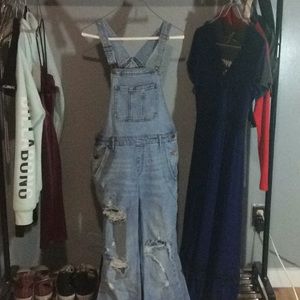 Distressed jean overalls